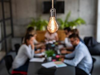 Lighbulb over business meeting